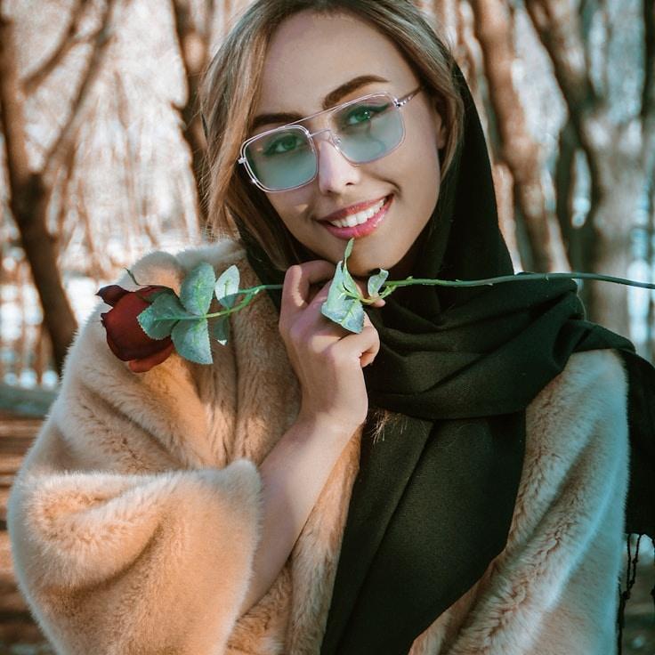 Ariana Singh, Lead Design Curator at Garden Arcade Pulse, reviewing corporate floral arrangements
